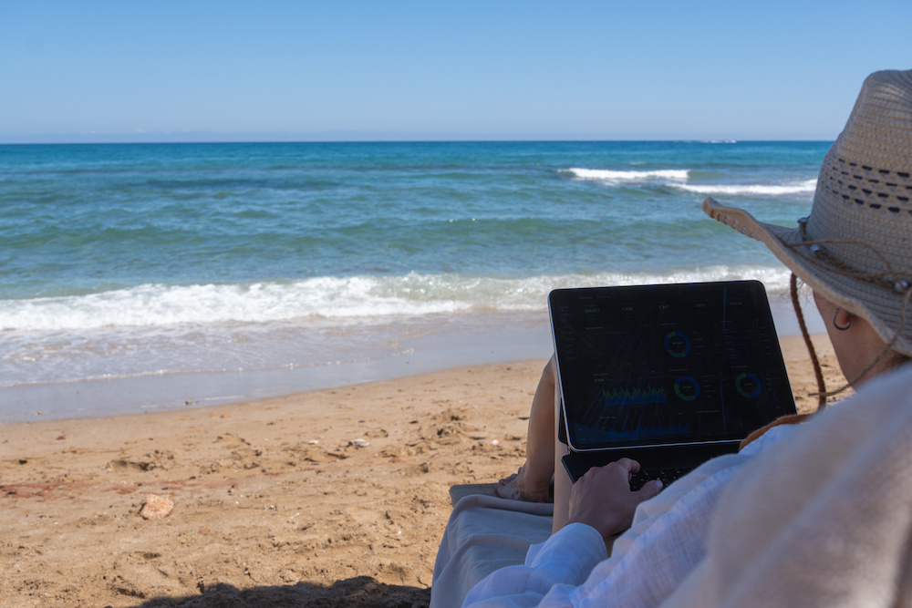 Working Remotely in Port Aransas - Woman on Laptop on Beach